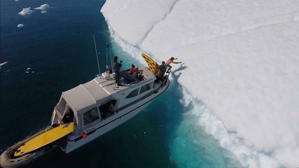 Daredevil Slides Down Iceberg on Inflatable Pizza – Swimline