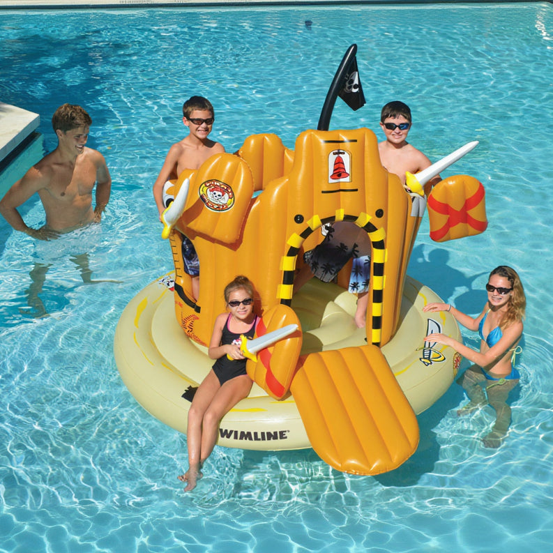 Children playing on an inflatable water slide in a pool