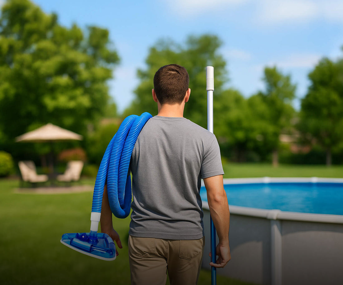 Man carrying pool cleaning equipment near an above-ground pool with trees in the background