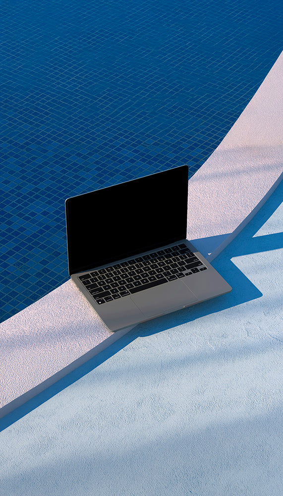Laptop on a blue and white surface