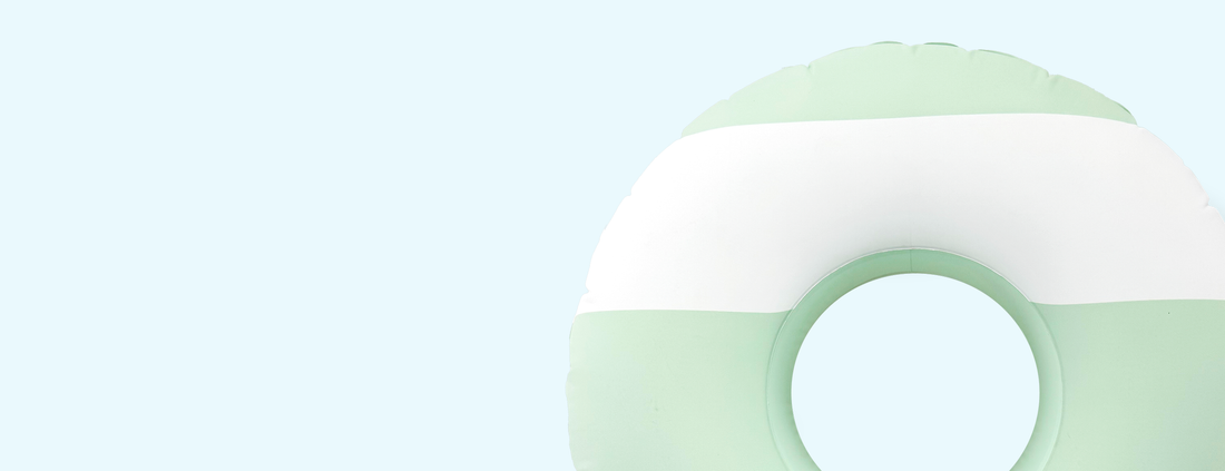 Pastel green and white float on a light blue background