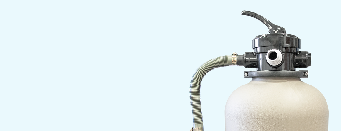White cylindrical water filter with black valve on a light gray background